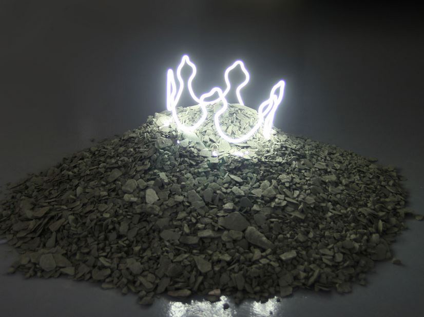 The King is Dead, Neon, high tension tube, black gravel and slate, diameter on the floor about 1m, 2012